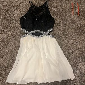 Peek-a-boo waist, short formal dress. Black and white/cream